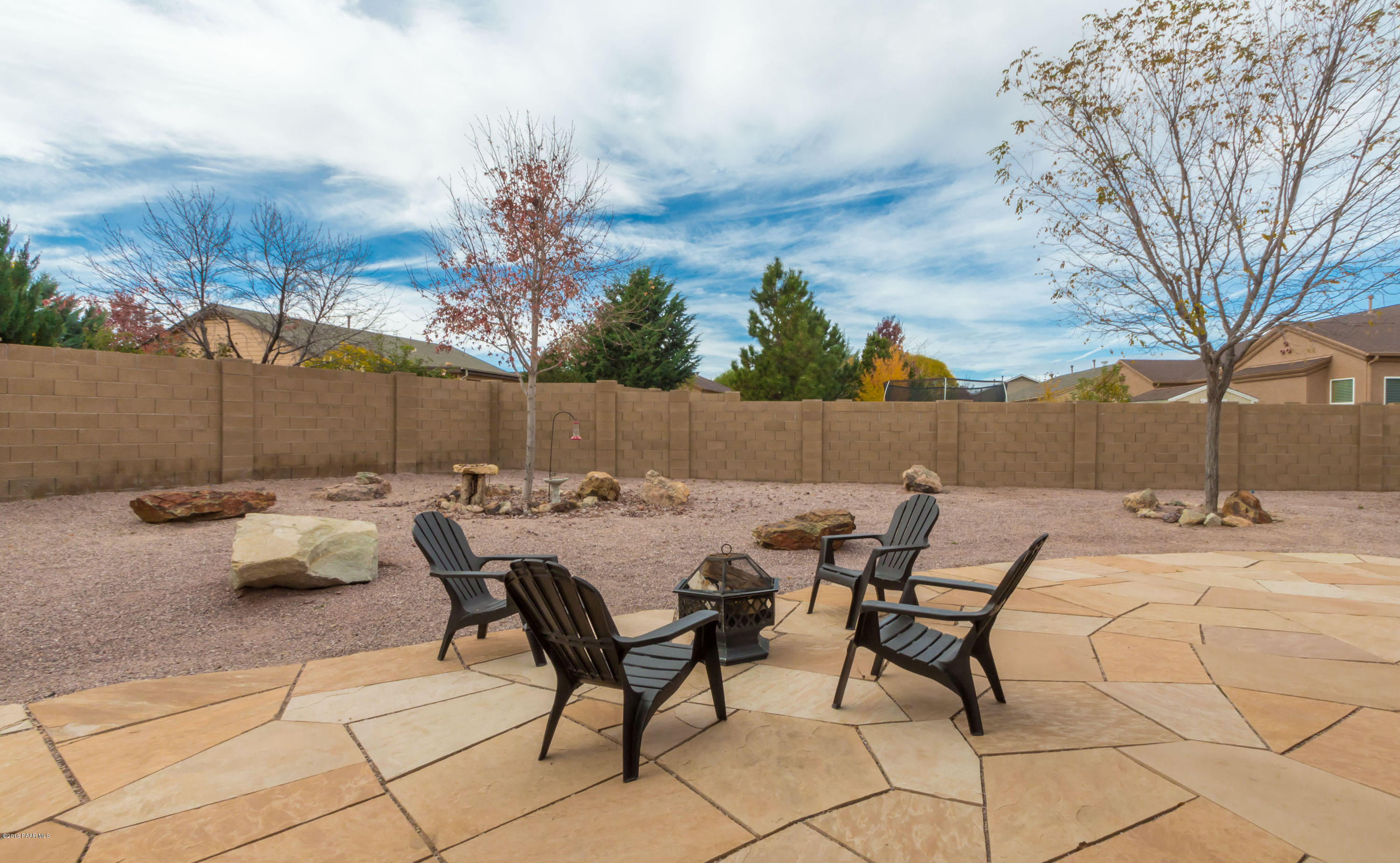 7887 East Mesteno Road Prescott Valley, AZ 86315 - Photo 26 of 30 a view of backyard with seating area and trees