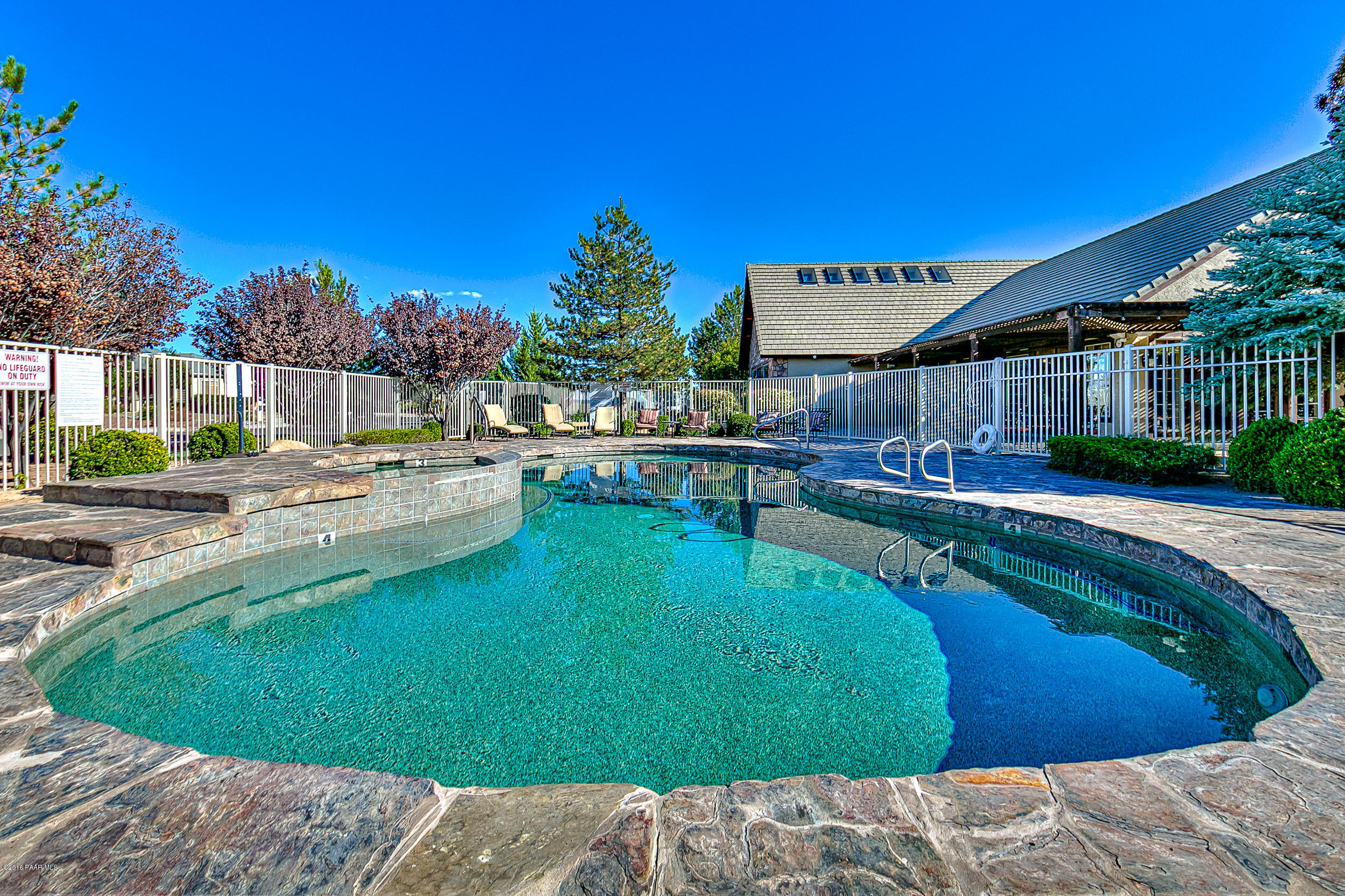 7887 East Mesteno Road Prescott Valley, AZ 86315 - Photo 30 of 30 a swimming pool with outdoor seating and yard