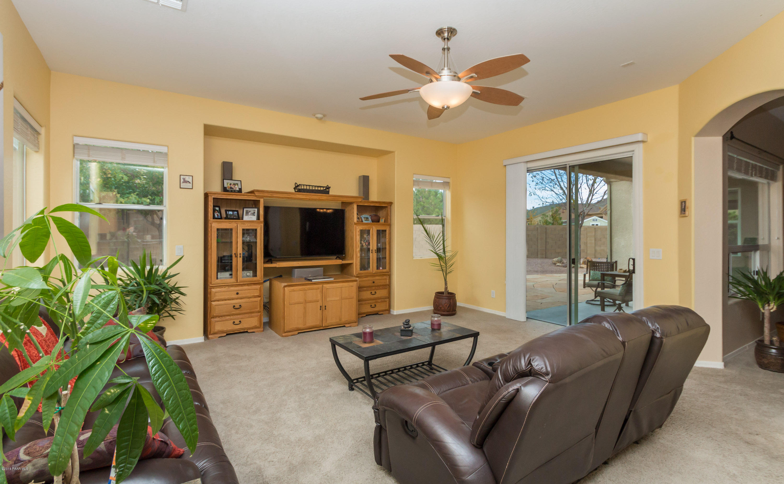 7887 East Mesteno Road Prescott Valley, AZ 86315 - Photo 6 of 30 a living room with furniture and a flat screen tv