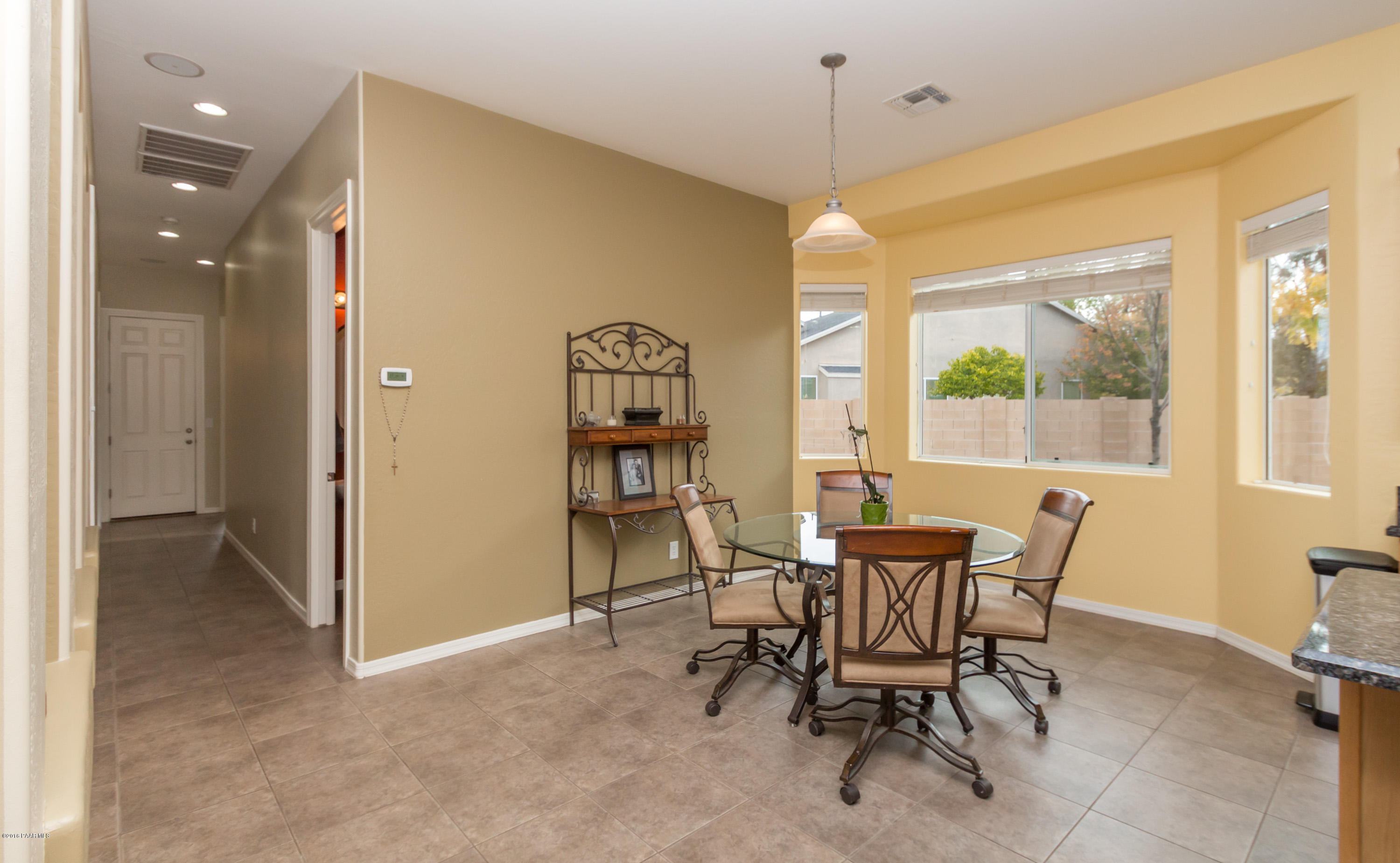 7887 East Mesteno Road Prescott Valley, AZ 86315 - Photo 9 of 30 a dining room with furniture and window