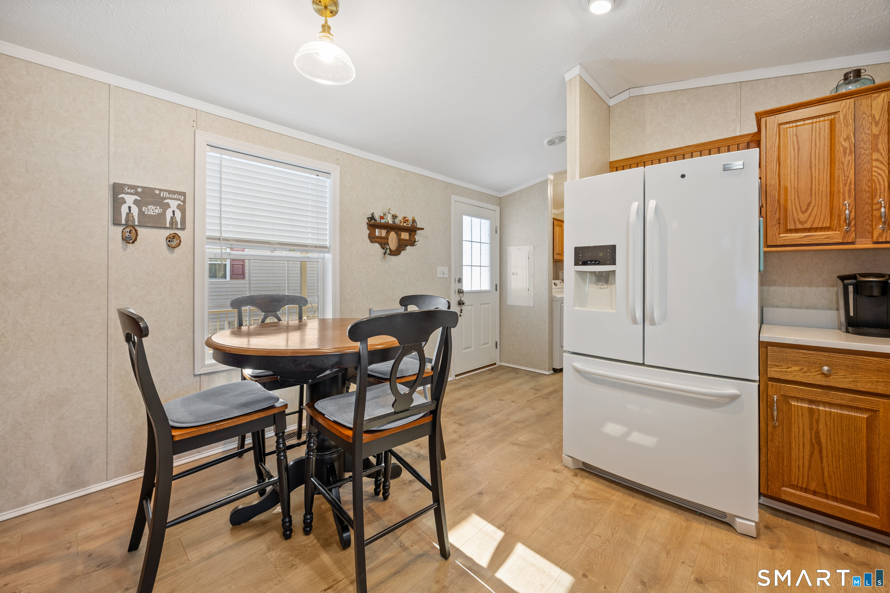 10 Meadow Road Southington, CT 06489 - Photo 11 of 23 a kitchen with stainless steel appliances refrigerator dining table and chairs