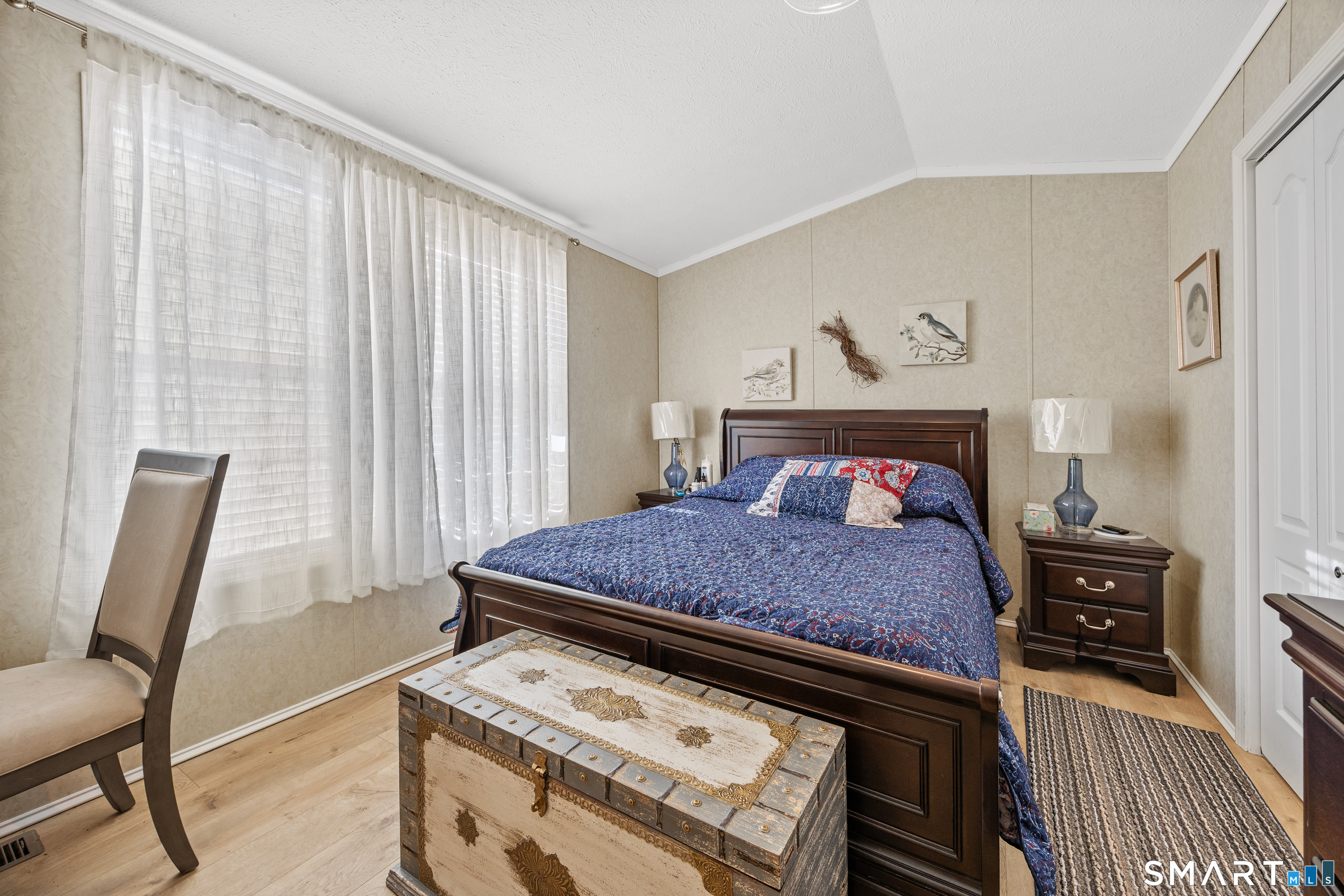 10 Meadow Road Southington, CT 06489 - Photo 14 of 23 a bed sitting in a bedroom next to a window