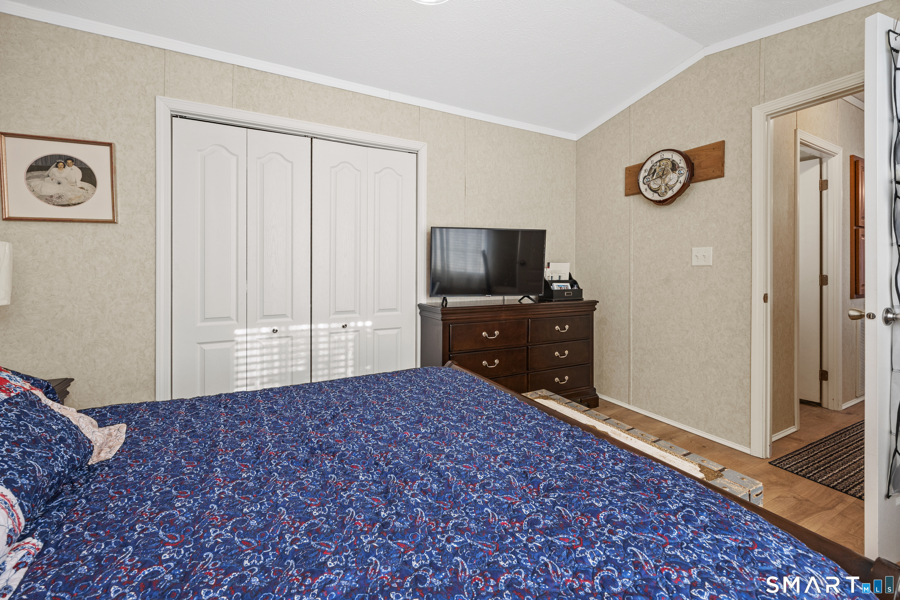 10 Meadow Road Southington, CT 06489 - Photo 15 of 23 a bedroom with a bed and a flat tv screen on dresser