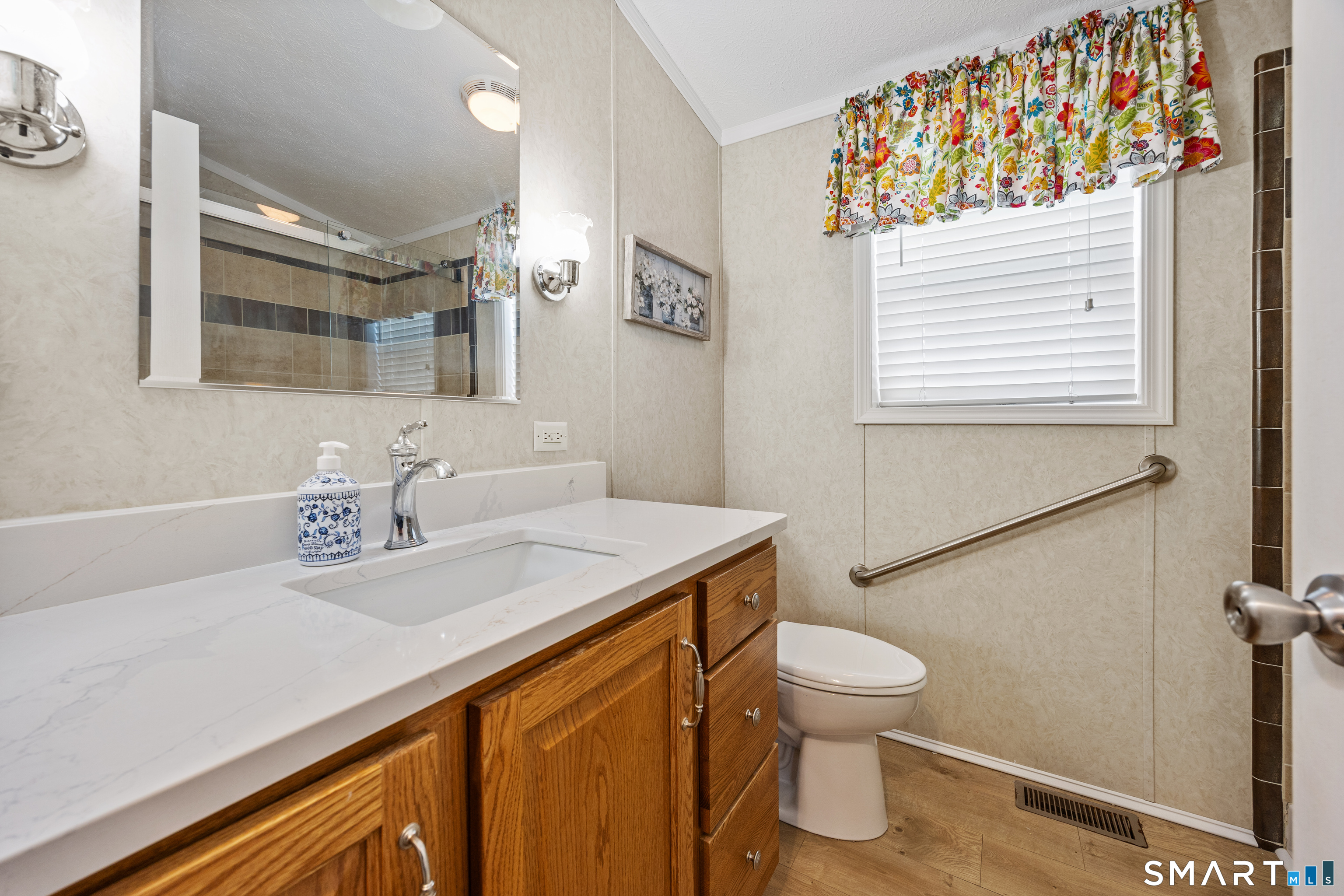 10 Meadow Road Southington, CT 06489 - Photo 16 of 23 a bathroom with a sink a toilet and mirror