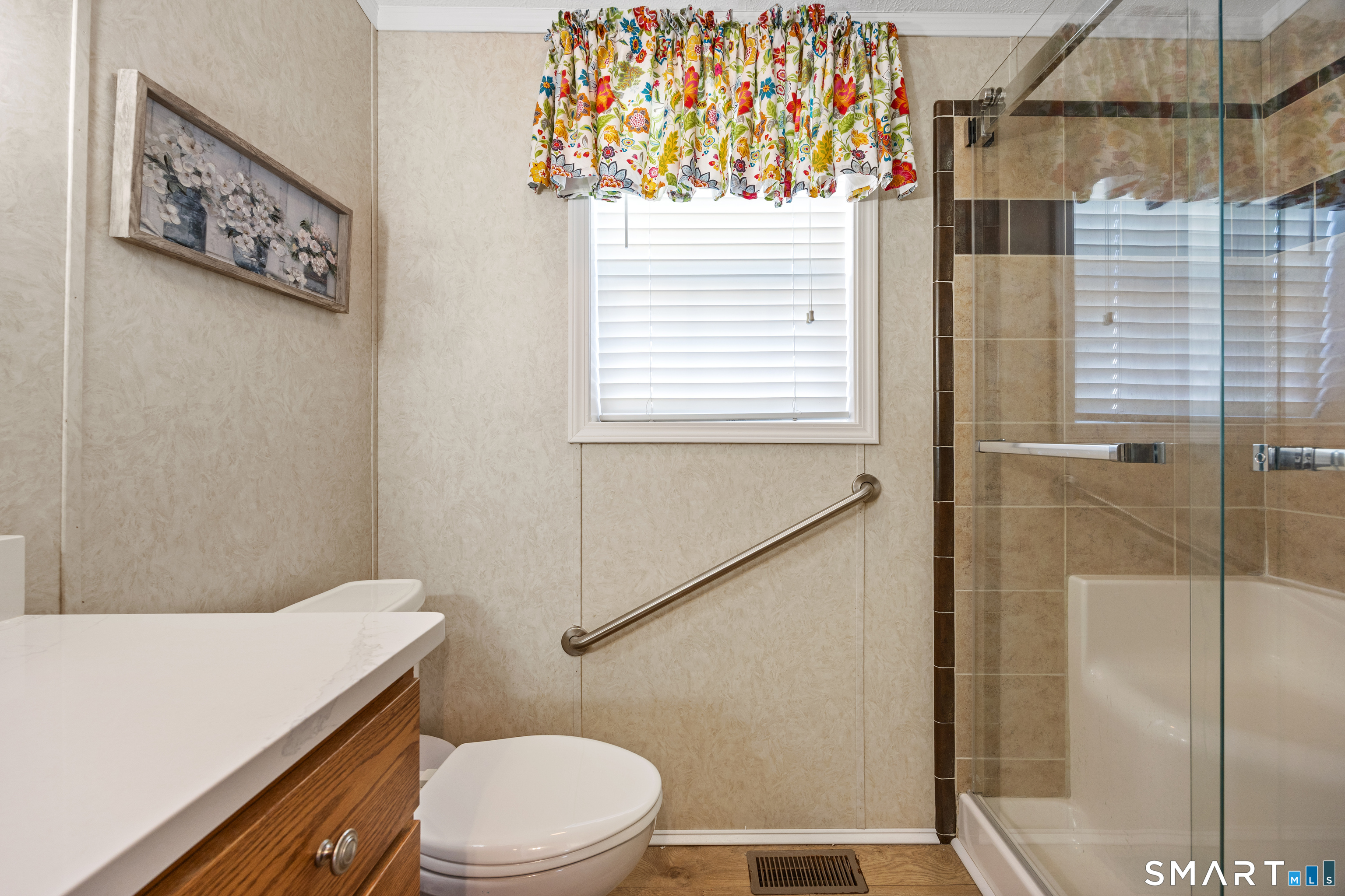 10 Meadow Road Southington, CT 06489 - Photo 17 of 23 a bathroom with a toilet sink and shower