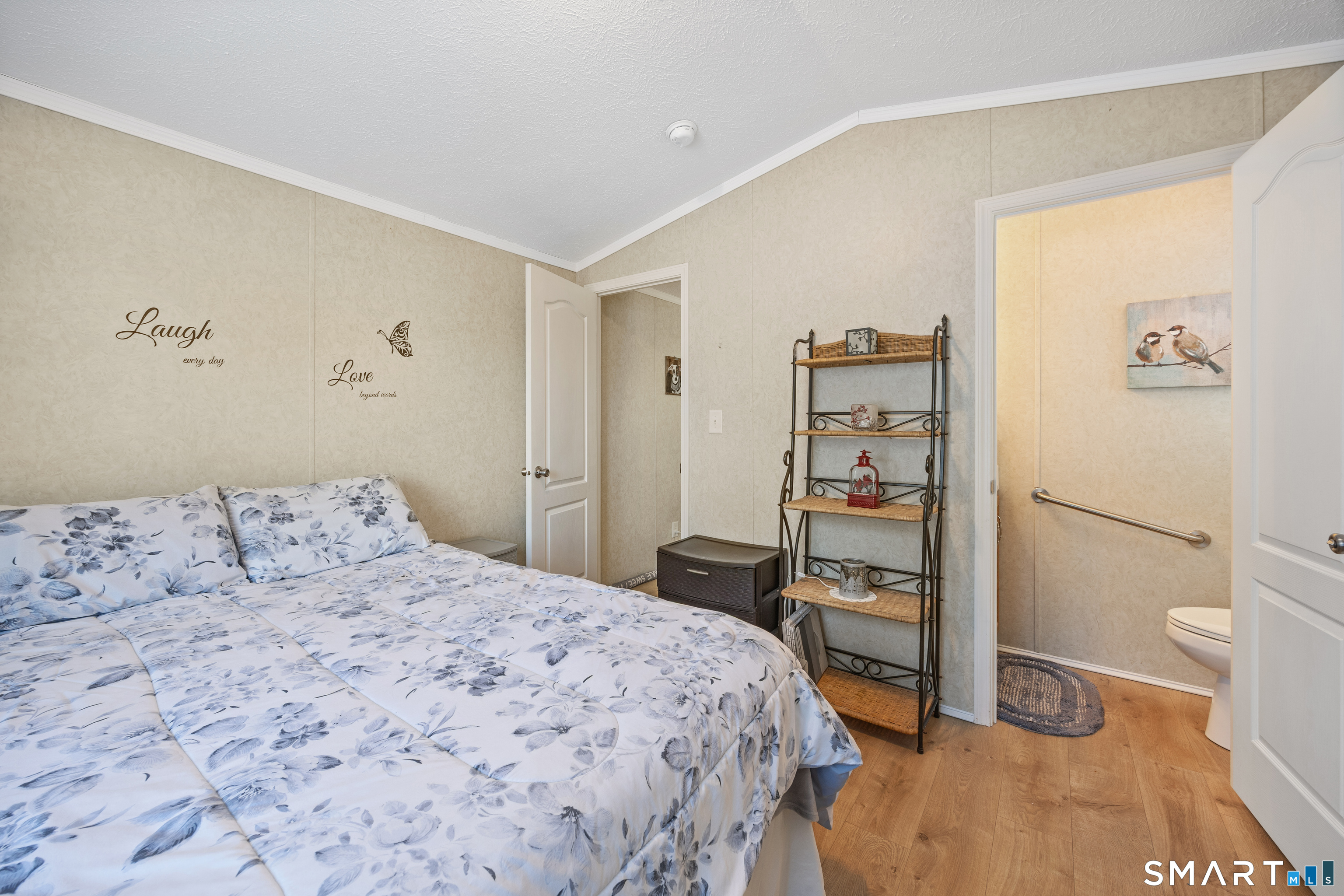 10 Meadow Road Southington, CT 06489 - Photo 20 of 23 a bedroom with a bed and a table in it