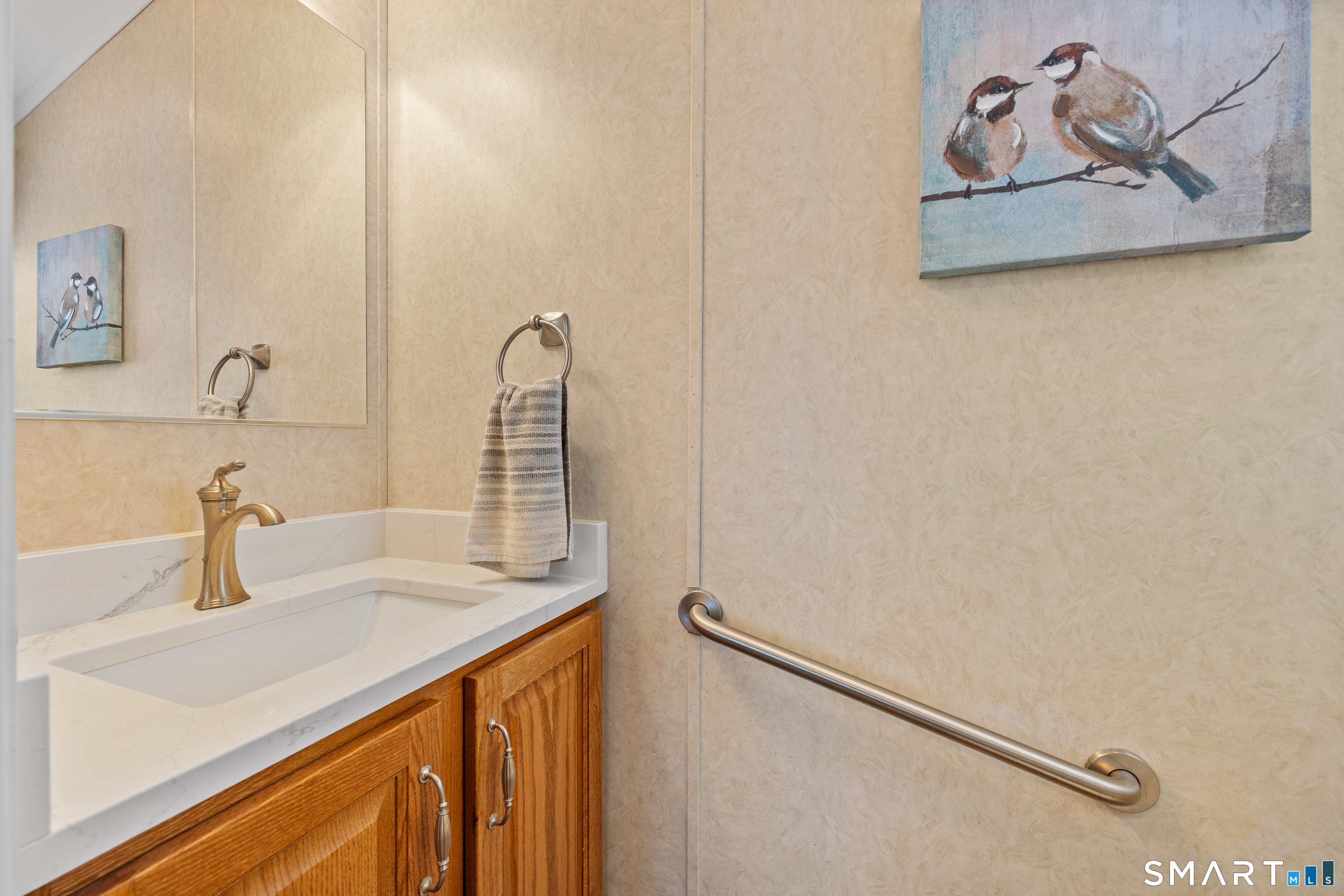 10 Meadow Road Southington, CT 06489 - Photo 21 of 23 a bathroom with a sink and a mirror