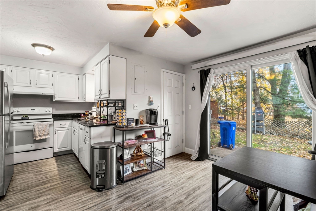 23 Magnolia Street, Unit 2 Attleboro, MA 02703 - Photo 12 of 32 a kitchen with stainless steel appliances granite countertop a stove and refrigerator