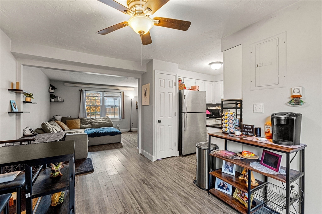 23 Magnolia Street, Unit 2 Attleboro, MA 02703 - Photo 13 of 32 a living room with furniture and a wooden floor