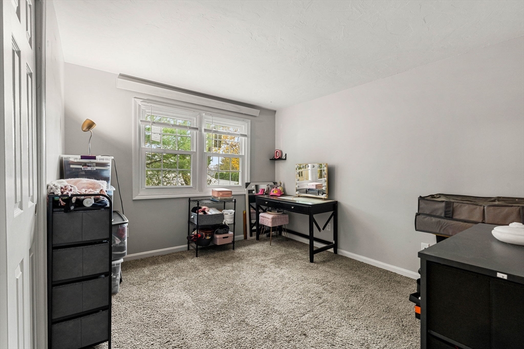 23 Magnolia Street, Unit 2 Attleboro, MA 02703 - Photo 17 of 32 a view of a workspace with furniture and a window