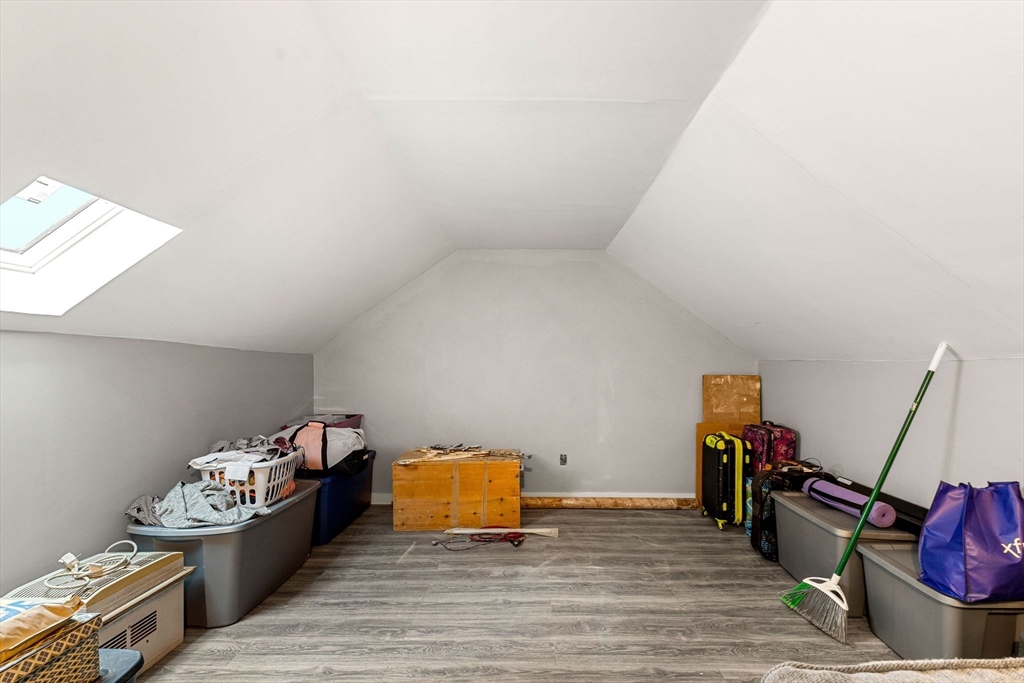 23 Magnolia Street, Unit 2 Attleboro, MA 02703 - Photo 25 of 32 a bed room with a bed and a desk