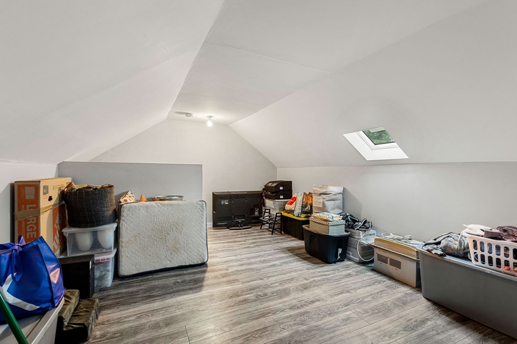 23 Magnolia Street, Unit 2 Attleboro, MA 02703 - Photo 26 of 32 a living room with furniture and a wooden floor