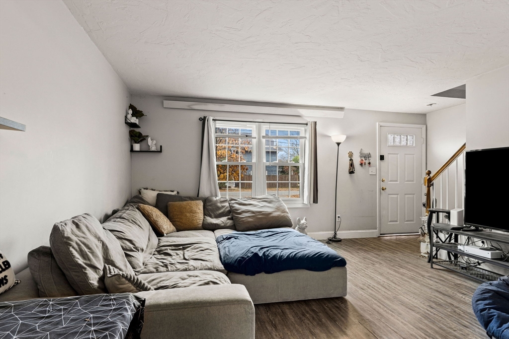 23 Magnolia Street, Unit 2 Attleboro, MA 02703 - Photo 7 of 32 a living room with furniture and a flat screen tv