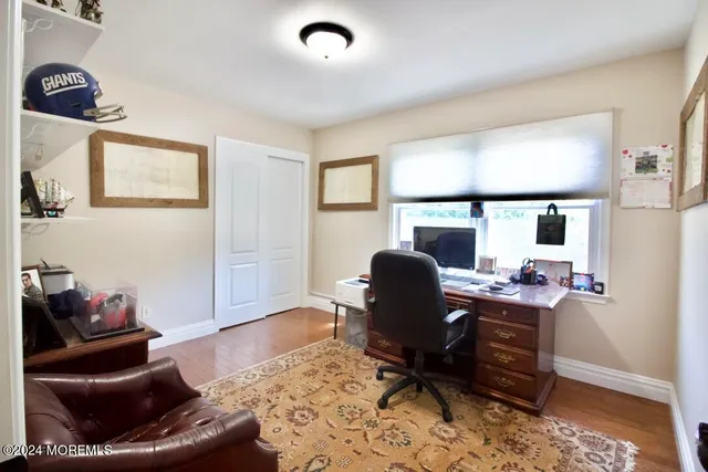 a work room with furniture and wooden floor