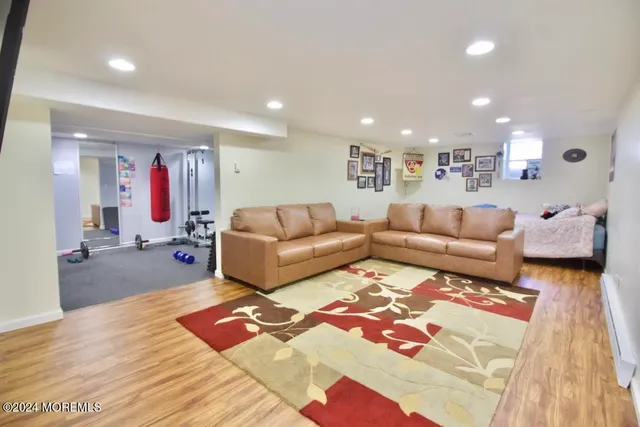 a living room with furniture or couch and a wooden floor