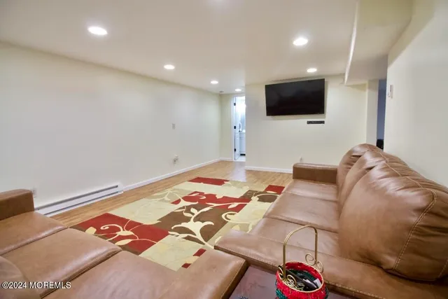 a living room with a couch and a flat screen tv
