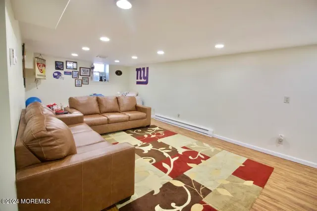 a living room with furniture and a rug