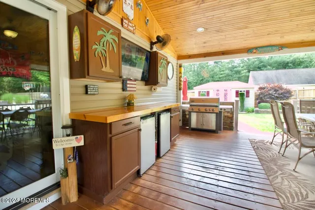 a kitchen with stainless steel appliances granite countertop a sink and a stove