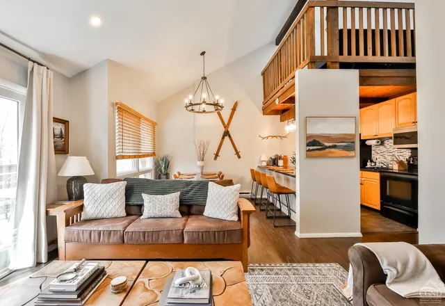 a kitchen with stainless steel appliances granite countertop a refrigerator and a stove
