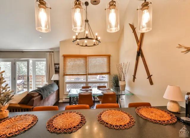 a kitchen with stainless steel appliances a stove top oven a sink and a microwave