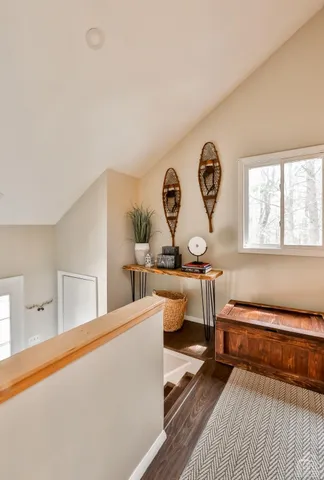 a view of a bedroom with stairs and furniture