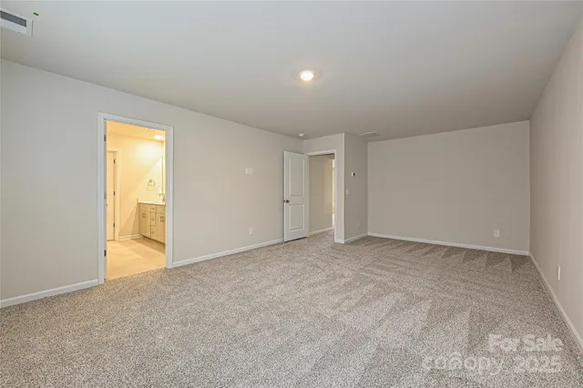 a view of an empty room and a window