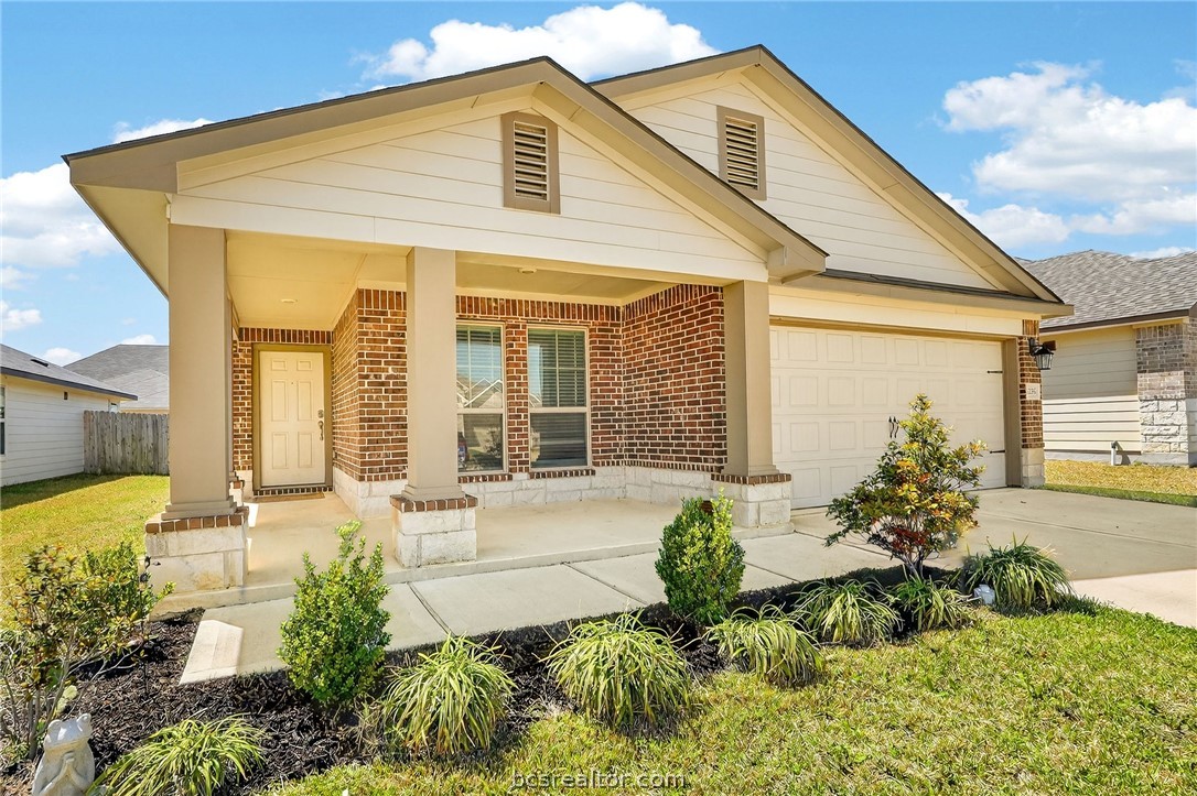 5235 Montague Loop Bryan, TX 77807 - Photo 2 of 25 a front view of a house with a yard