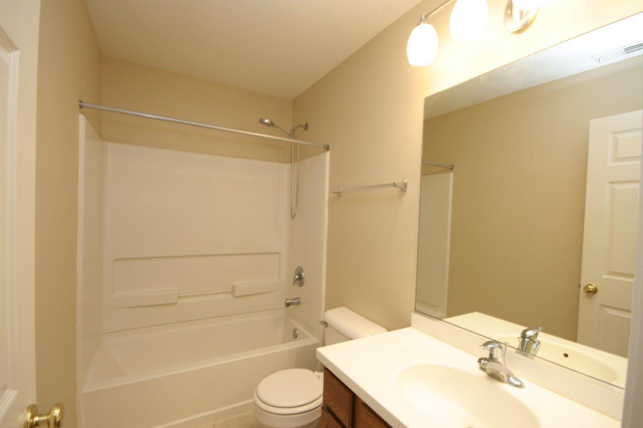 114 Jackson Street Gilberts, IL 60136 - Photo 12 of 18 a bathroom with a sink toilet and shower