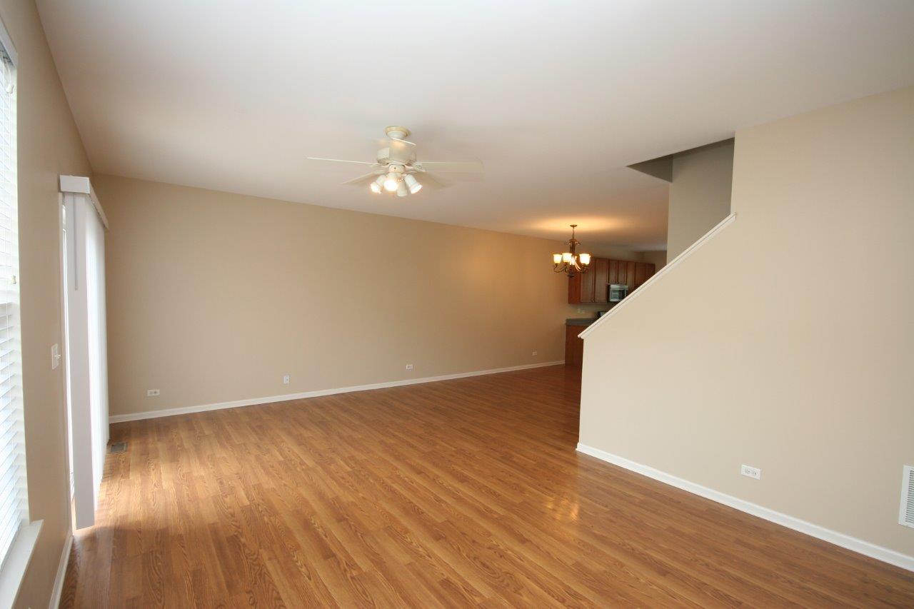114 Jackson Street Gilberts, IL 60136 - Photo 5 of 18 a view of a room with wooden floor