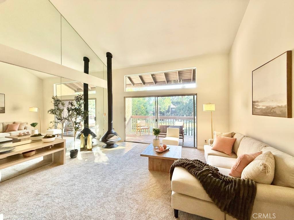 7890 East Spring Street, Unit 2F Long Beach, CA 90815 - Photo 12 of 64 a living room with furniture and a large window