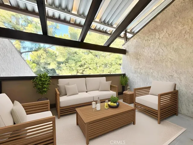 a view of an outdoor space with wooden floor and door