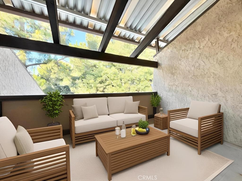 7890 East Spring Street, Unit 2F Long Beach, CA 90815 - Photo 17 of 64 a living room with furniture and a large window