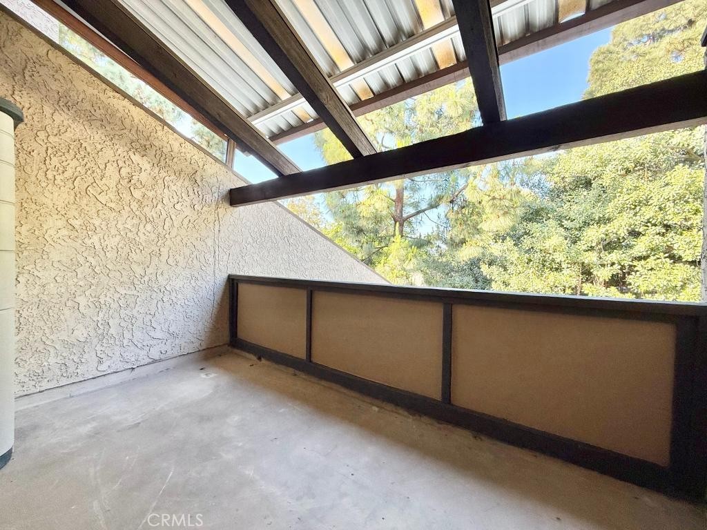 7890 East Spring Street, Unit 2F Long Beach, CA 90815 - Photo 19 of 64 a view of an outdoor space with wooden floor and door