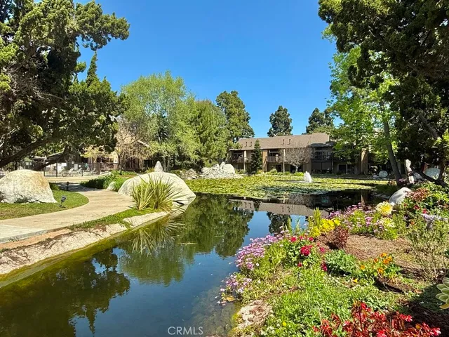 a swimming pool with outdoor seating and yard