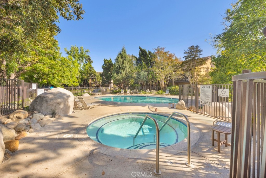 7890 East Spring Street, Unit 2F Long Beach, CA 90815 - Photo 23 of 64 a view of backyard with swimming pool and outdoor seating