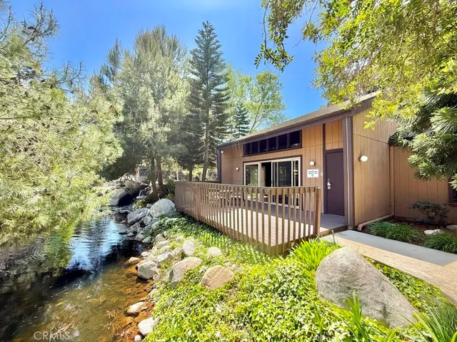 a dining room with furniture and a window