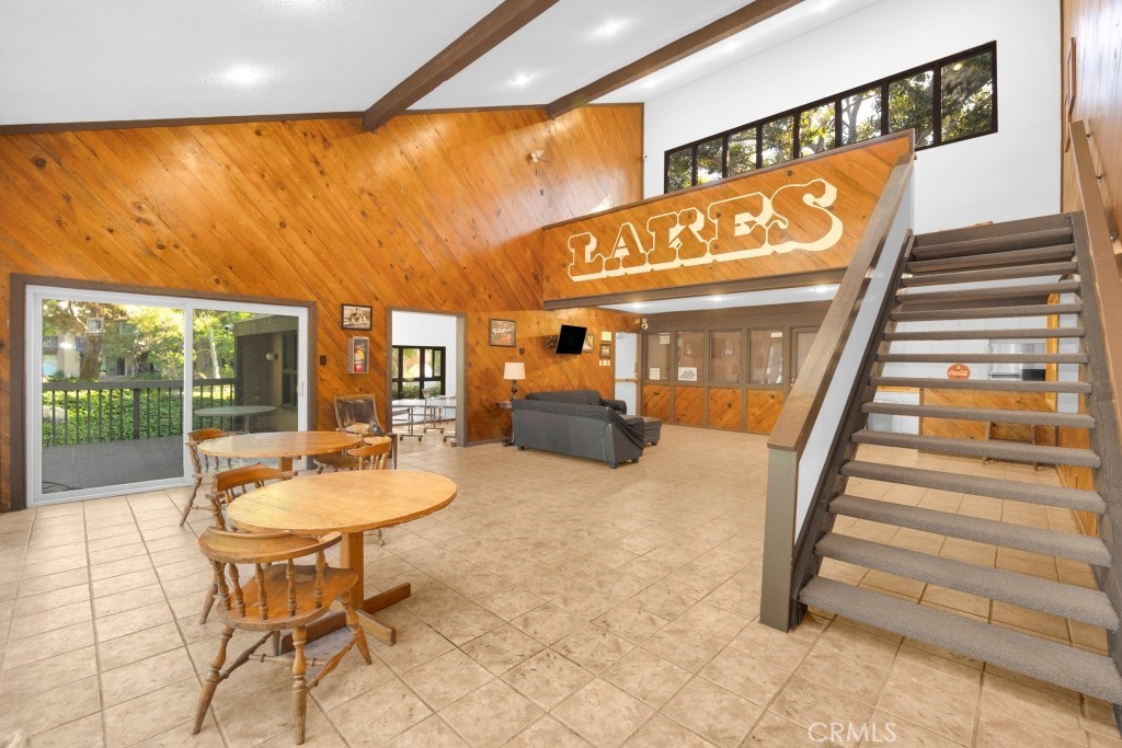 7890 East Spring Street, Unit 2F Long Beach, CA 90815 - Photo 31 of 64 a dining room with furniture and a floor to ceiling window