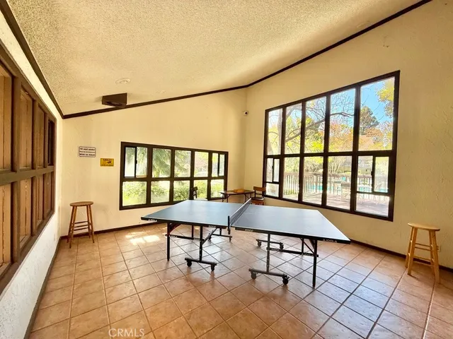a view of yard with seating area and trees around