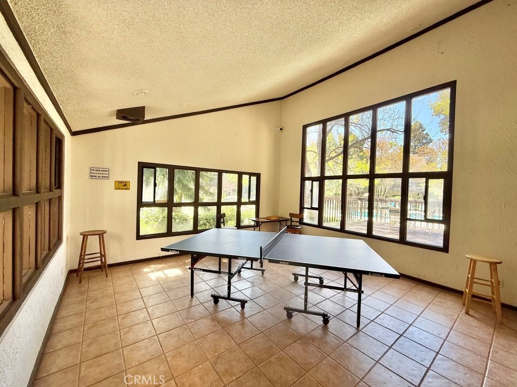 7890 East Spring Street, Unit 2F Long Beach, CA 90815 - Photo 34 of 64 a dining room with furniture and a window