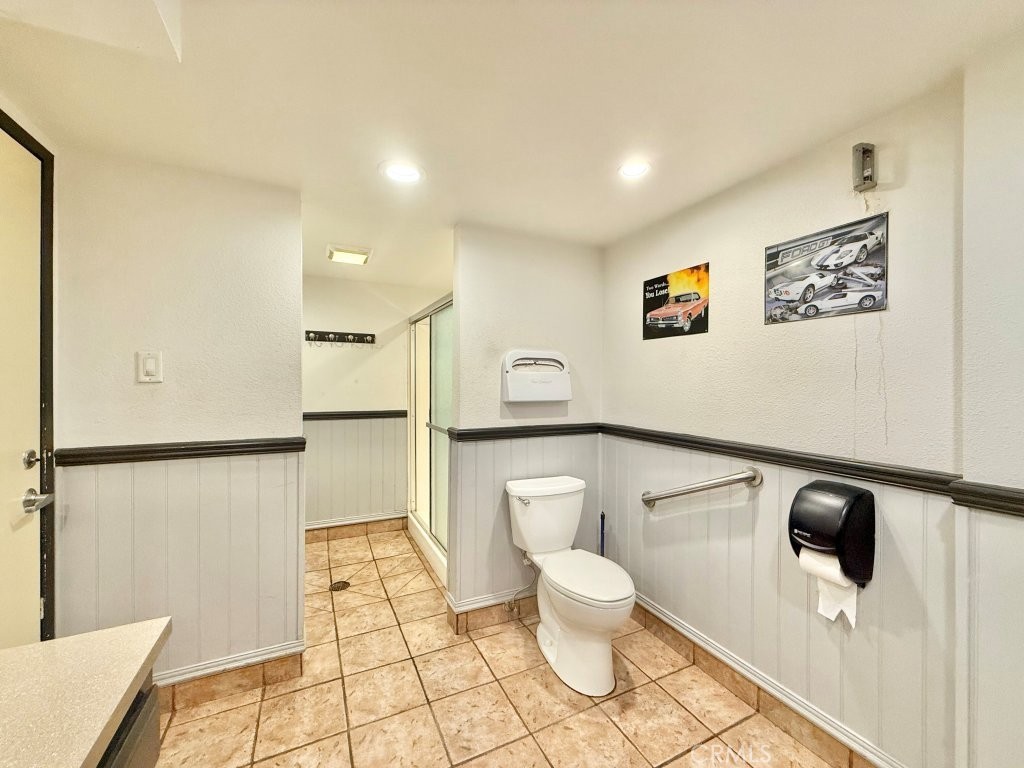 7890 East Spring Street, Unit 2F Long Beach, CA 90815 - Photo 36 of 64 a bathroom with a toilet and a shower