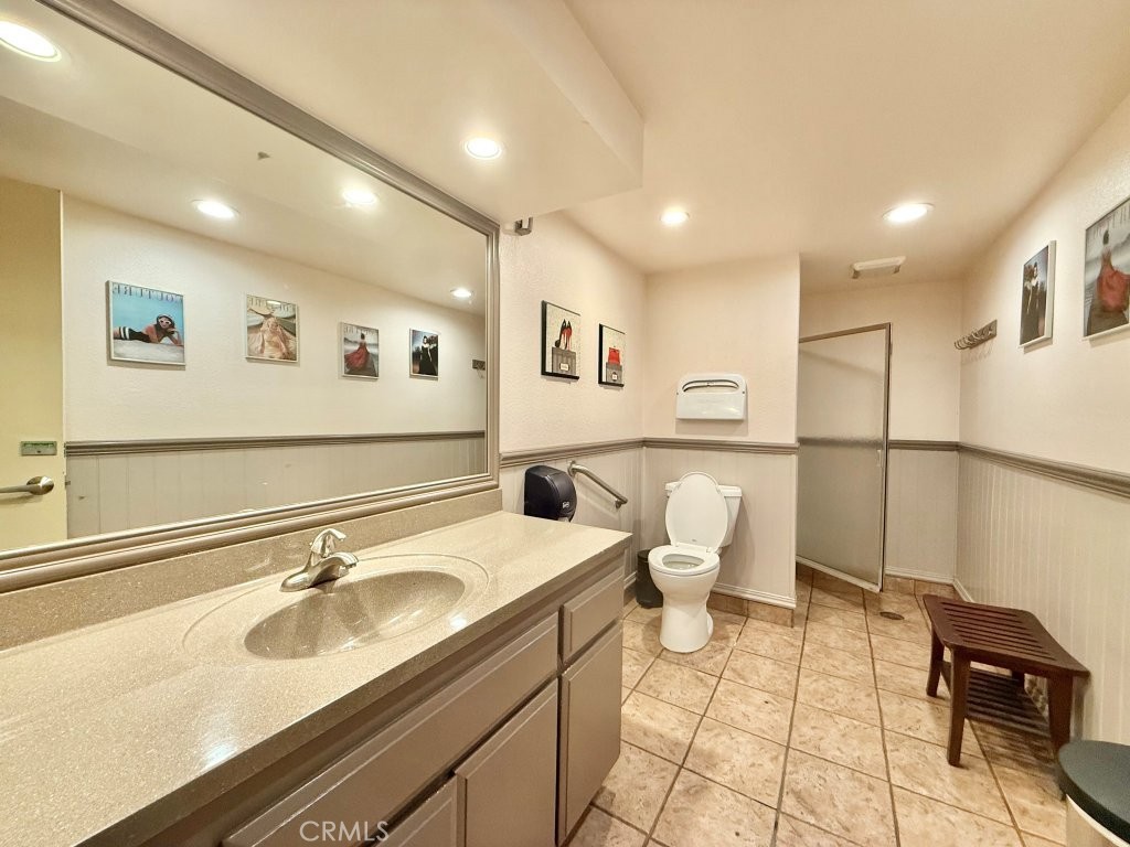 7890 East Spring Street, Unit 2F Long Beach, CA 90815 - Photo 38 of 64 a bathroom with a sink and a mirror