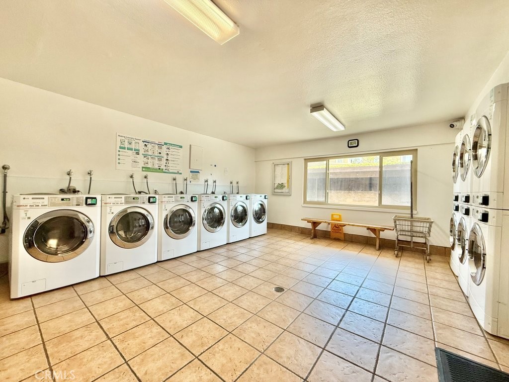 7890 East Spring Street, Unit 2F Long Beach, CA 90815 - Photo 39 of 64 a view of a storage & utility room with washer and dryer