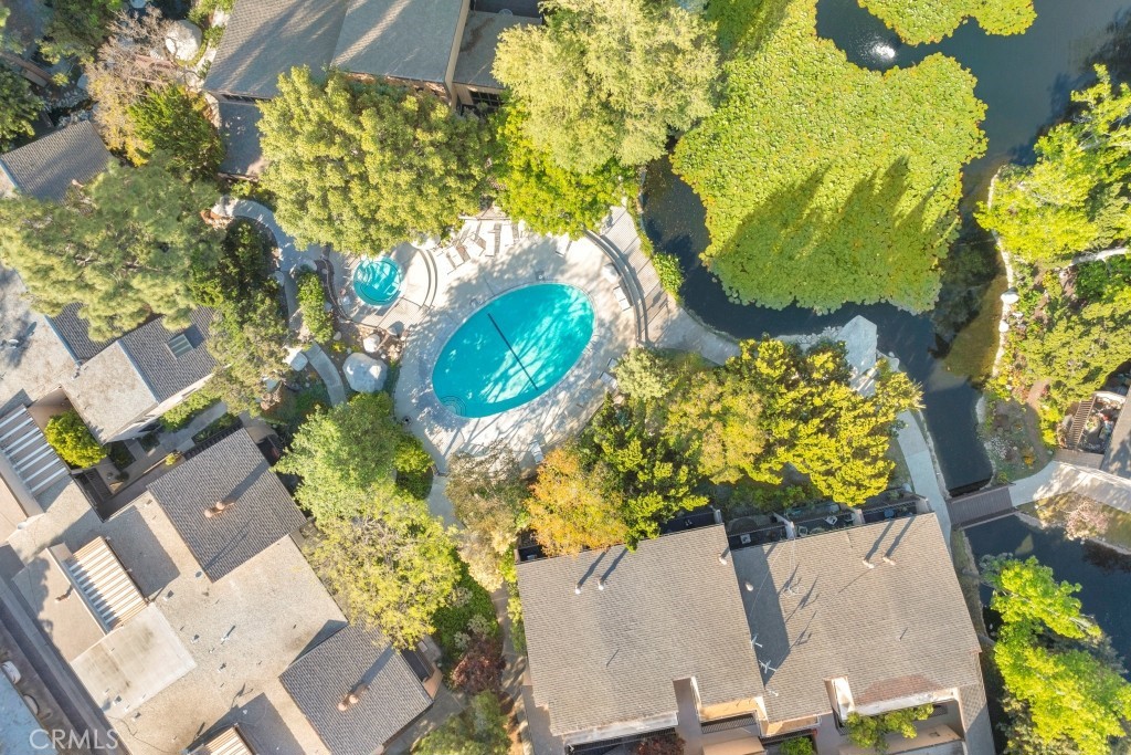 7890 East Spring Street, Unit 2F Long Beach, CA 90815 - Photo 42 of 64 an aerial view of a residential house with yard and swimming pool