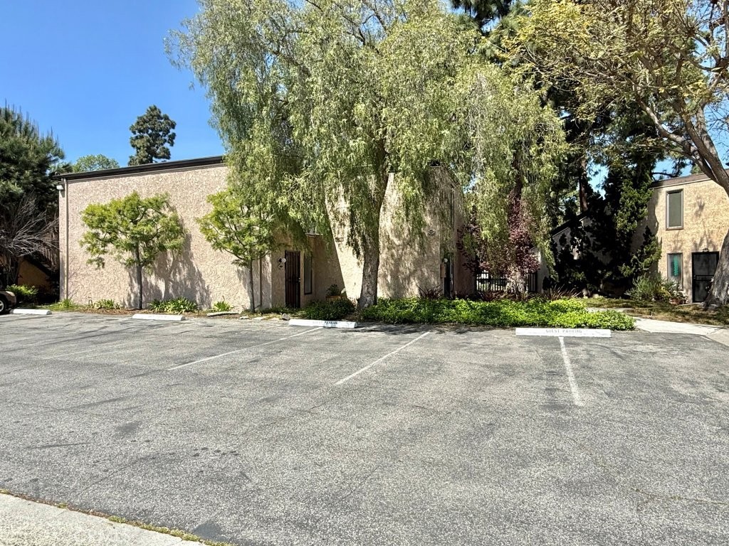 7890 East Spring Street, Unit 2F Long Beach, CA 90815 - Photo 56 of 64 a view of a house with a street