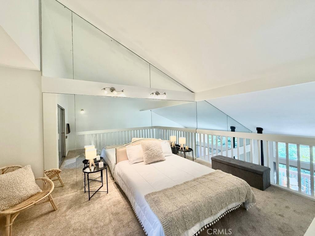 7890 East Spring Street, Unit 2F Long Beach, CA 90815 - Photo 6 of 64 a bedroom with a bed and window