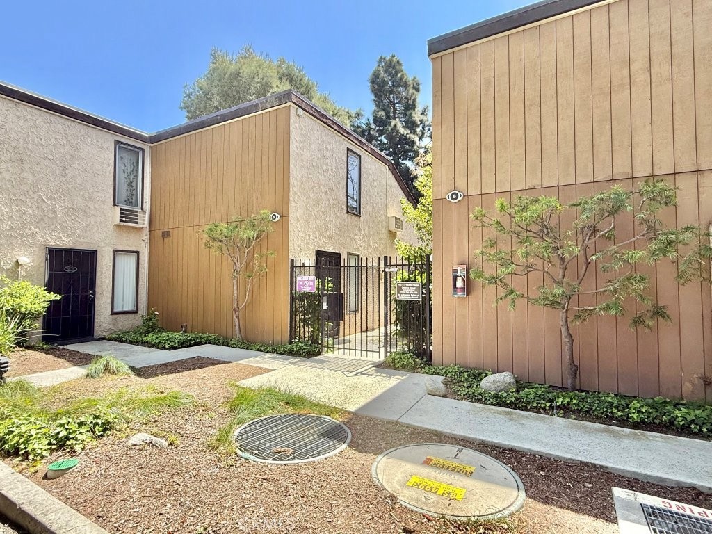 7890 East Spring Street, Unit 2F Long Beach, CA 90815 - Photo 63 of 64 a bathroom with a granite countertop sink and a mirror