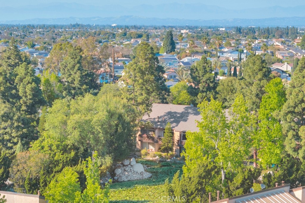 7890 East Spring Street, Unit 2F Long Beach, CA 90815 - Photo 64 of 64 an aerial view of residential building and trees around