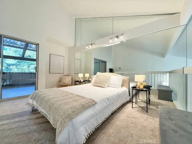 a bedroom with bed and window