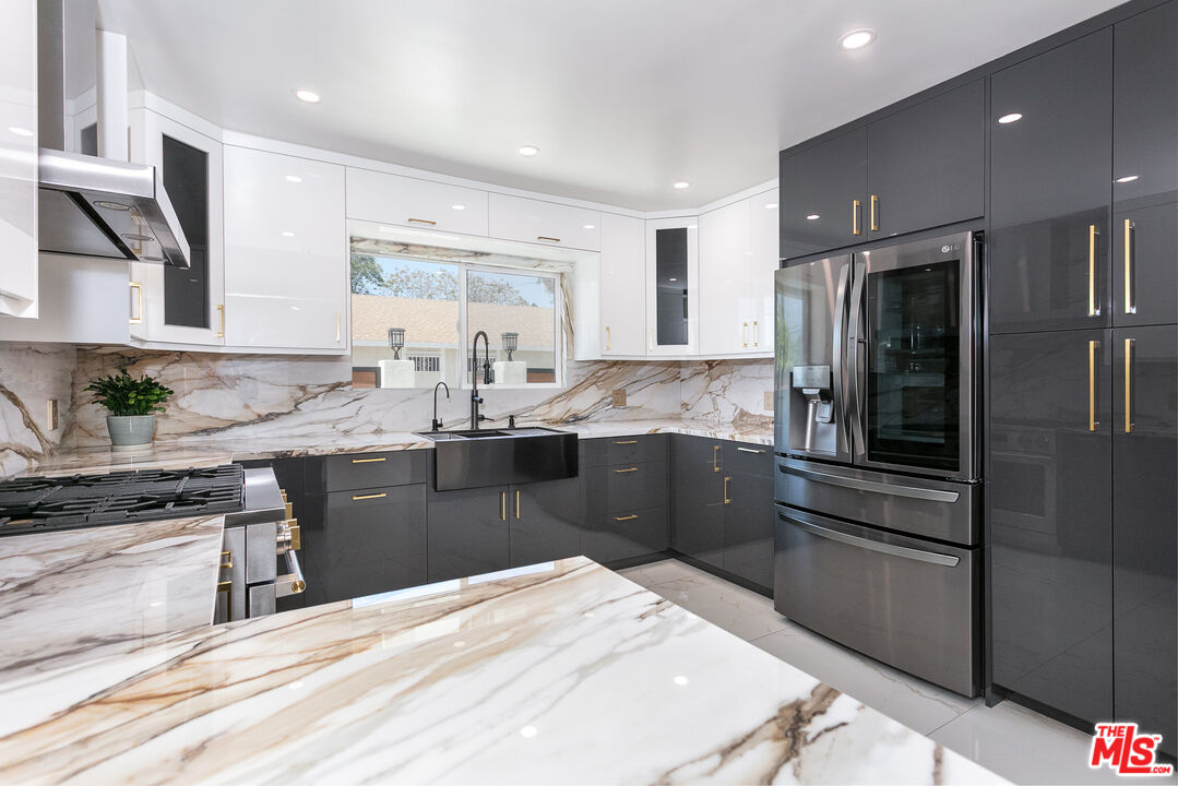 7001 Beckett Street Tujunga, CA 91042 - Photo 1 of 21 a kitchen with a sink stainless steel appliances and cabinets