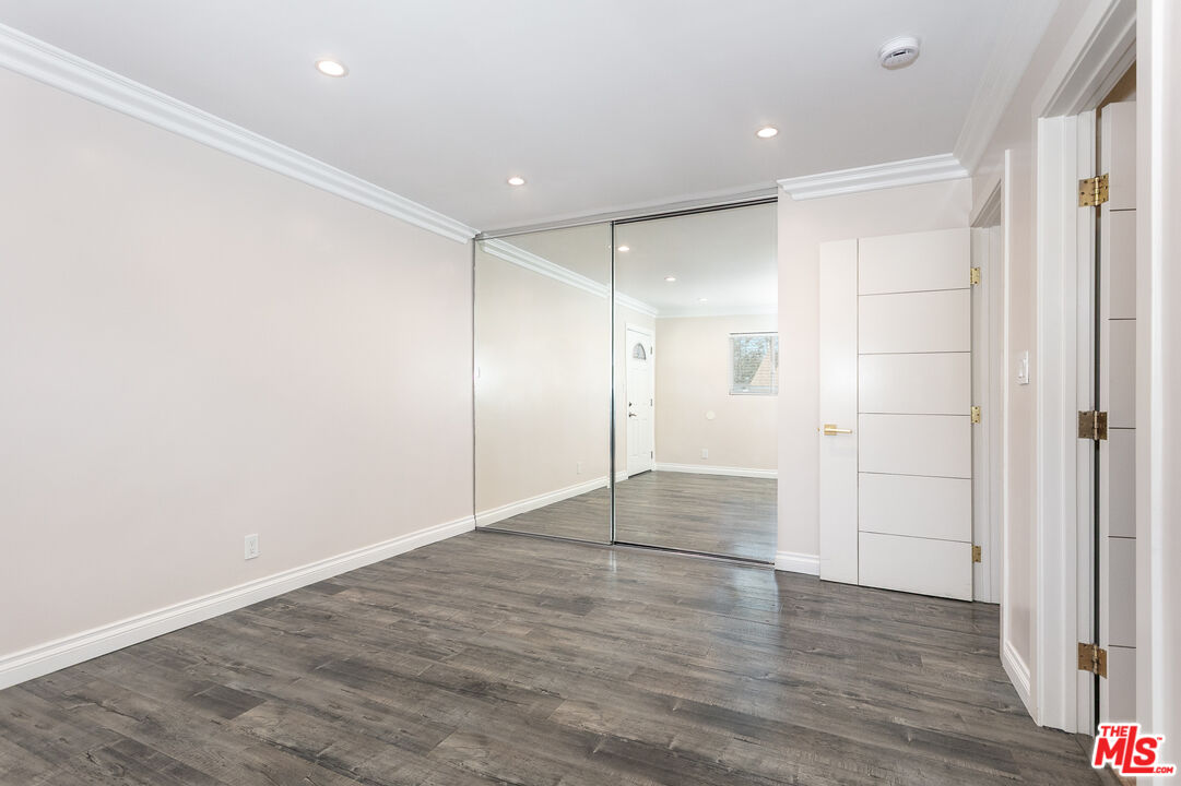 7001 Beckett Street Tujunga, CA 91042 - Photo 13 of 21 a view of an empty room with wooden floor